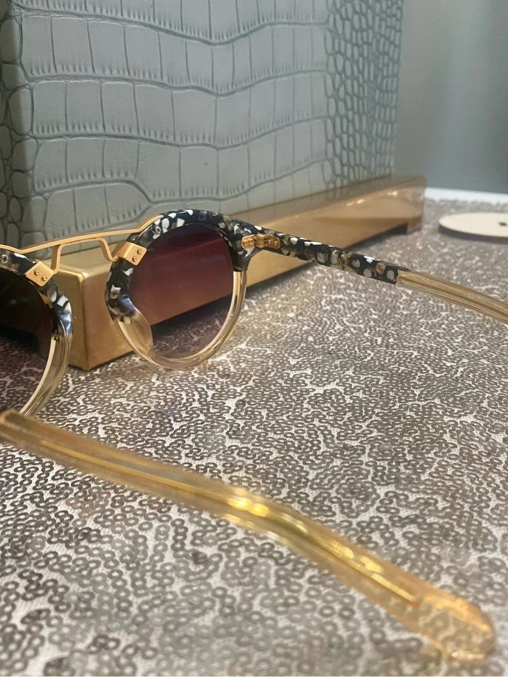 Gold-Tone Round Sunglasses with Black Patterned Brow and Purple Gradient Lenses